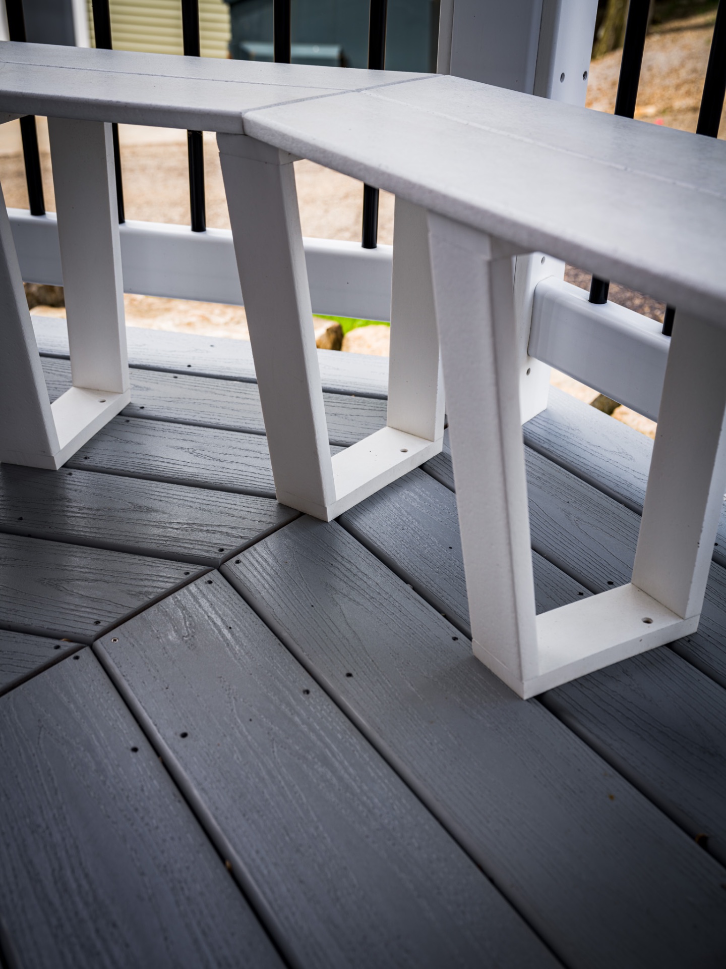 Clean composite deck restored to original grey after professional pressure washing