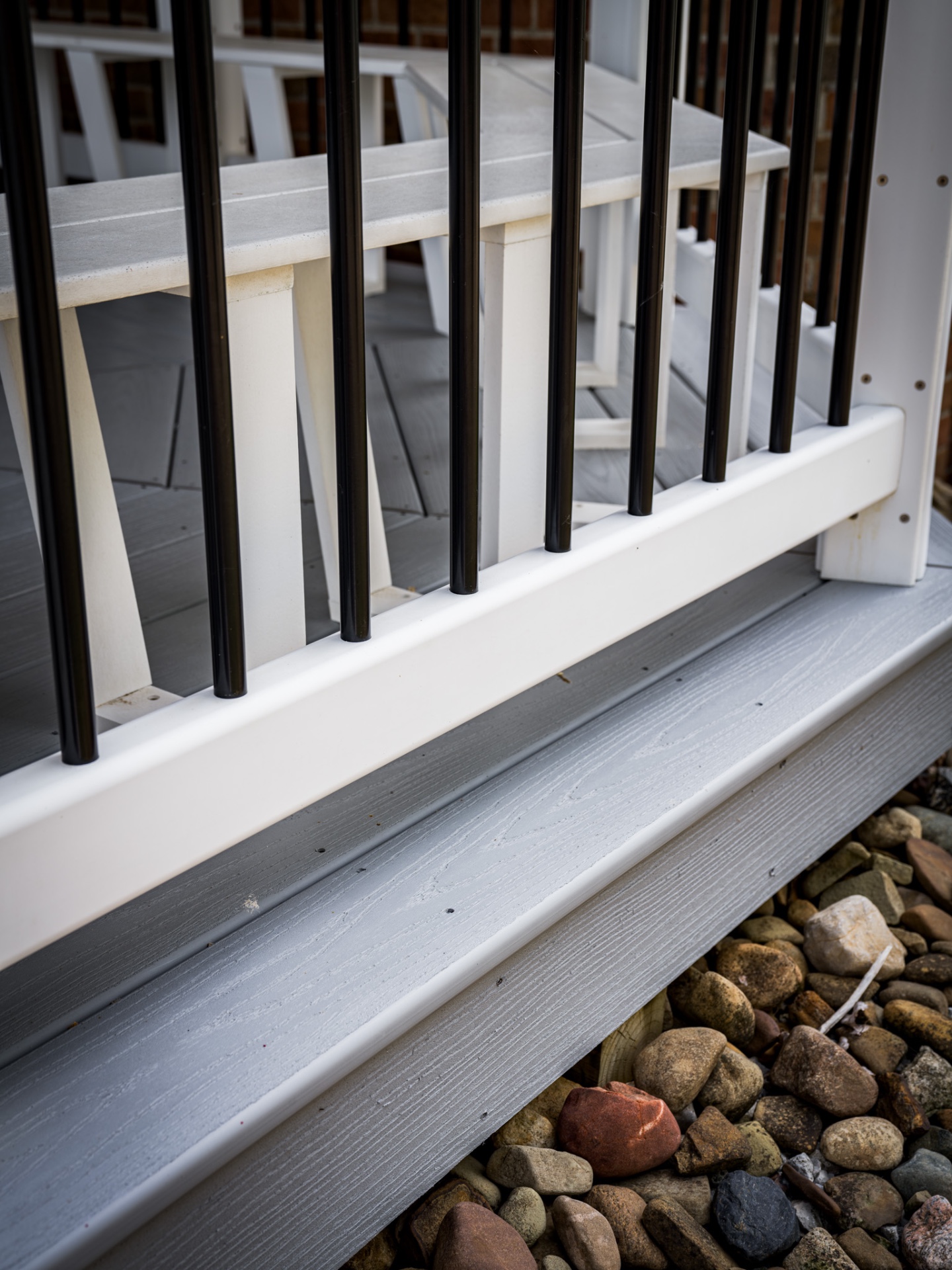 Bright white deck railing after soft wash cleaning